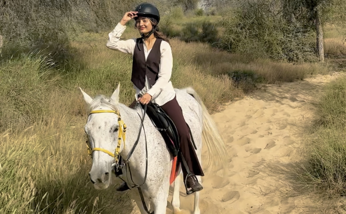 Sunset horse riding inside the lush trails of Mushrif Park, Dubai